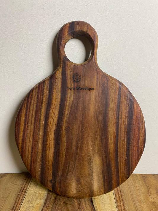 Handcrafted rosewood round cutting board Pure Woodique Pakistan