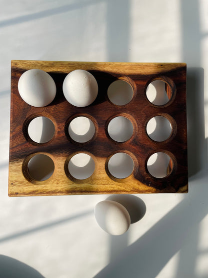 Wooden egg holder 12-slot top view showing egg slots and natural grain