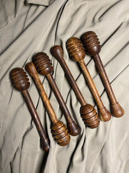 Wooden honey dipper dark finish close up of carved grooves